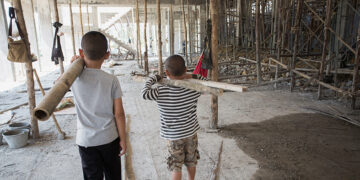 Image blur, Poor children working at construction site against children labour,  World Day Against Child Labour  and trafficking concept.; Shutterstock ID 1188822772; Purchase Order: -