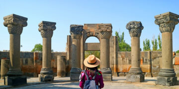 Female Traveler Visiting the Zvartnots Cathedral, UNESCO World Heritage Site in Armavir Province of Armenia