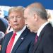 US President Donald Trump (L) talks to Turkeys President Recep Tayyip Erdogan (R) as they arrive for the NATO (North Atlantic Treaty Organization) summit, at the NATO headquarters in Brussels, on July 11, 2018. (Photo by Tatyana ZENKOVICH / POOL / AFP)