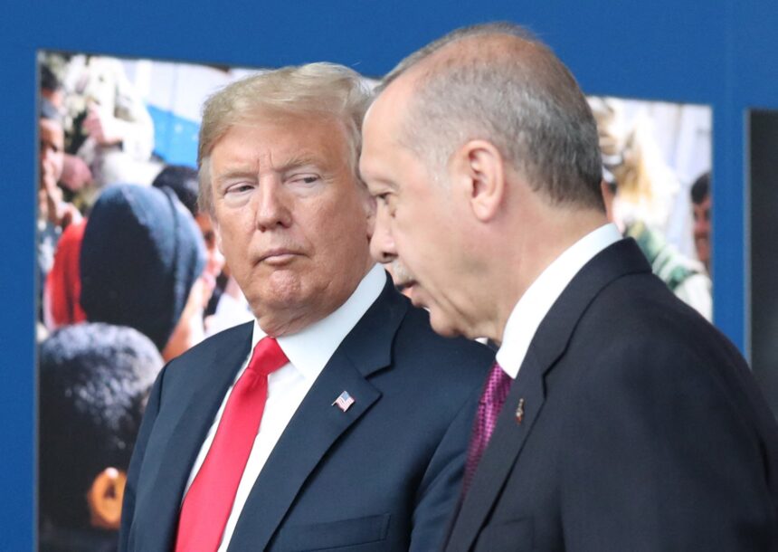 US President Donald Trump (L) talks to Turkeys President Recep Tayyip Erdogan (R) as they arrive for the NATO (North Atlantic Treaty Organization) summit, at the NATO headquarters in Brussels, on July 11, 2018. (Photo by Tatyana ZENKOVICH / POOL / AFP)