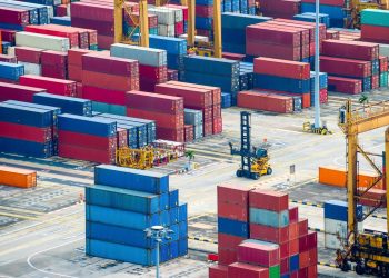 Aerial view of commercial port with colorful freight containers and equipment, Singapore