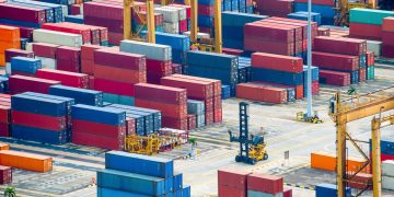 Aerial view of commercial port with colorful freight containers and equipment, Singapore
