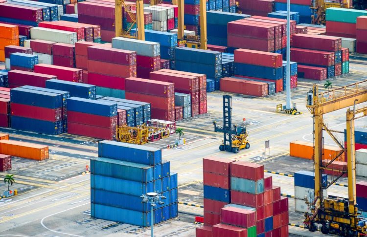 Aerial view of commercial port with colorful freight containers and equipment, Singapore